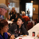 Jose Andres talks with wildfire evacuees during a community Thanksgiving dinner at California State University Chico on November 22 in Chico, California.